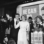Sen. Edward M. Kennedy at age 30, waves to party workers in Boston with his wife Joan after his election as democratic U.S. Senator from Massachusetts in Nov. 6, 1962.